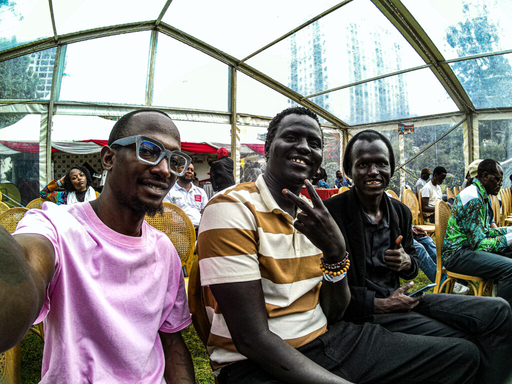 Isaac Kataryeba with K2 The Poet and Bey after their performances